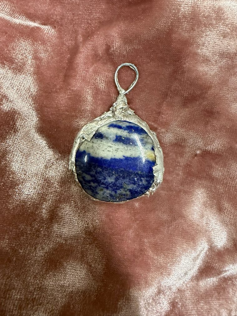 Lapis lazuli pendant in a hand soldered silver setting made by a student at a Cleveland Heights jewelry workshop