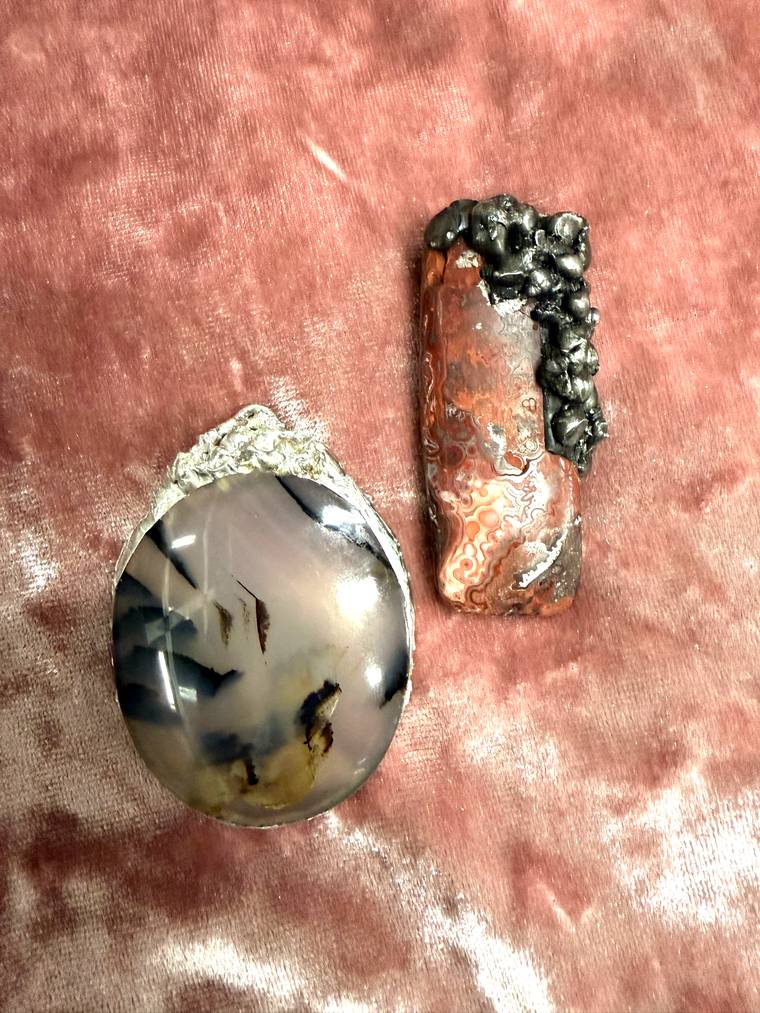 Dendritic agate and crazy lace agate pendants made at a Cleveland Heights jewelry workshop