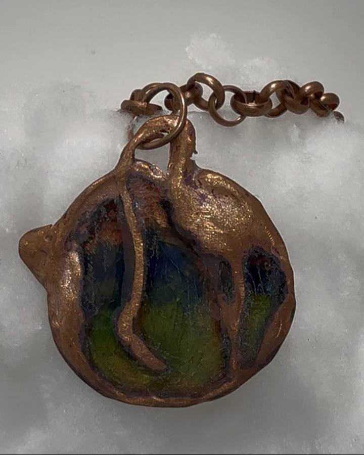Enameled copper crane pendant made from an antique impression die by a Cleveland Heights jeweler