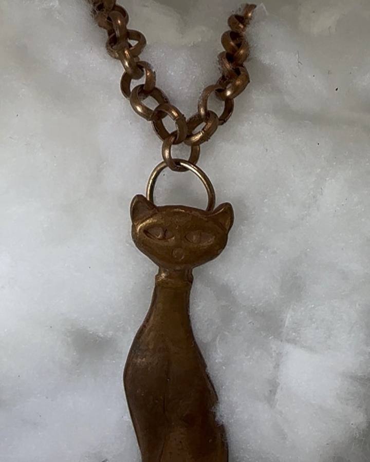 Art deco cat pendant struck in copper from an antique impression die