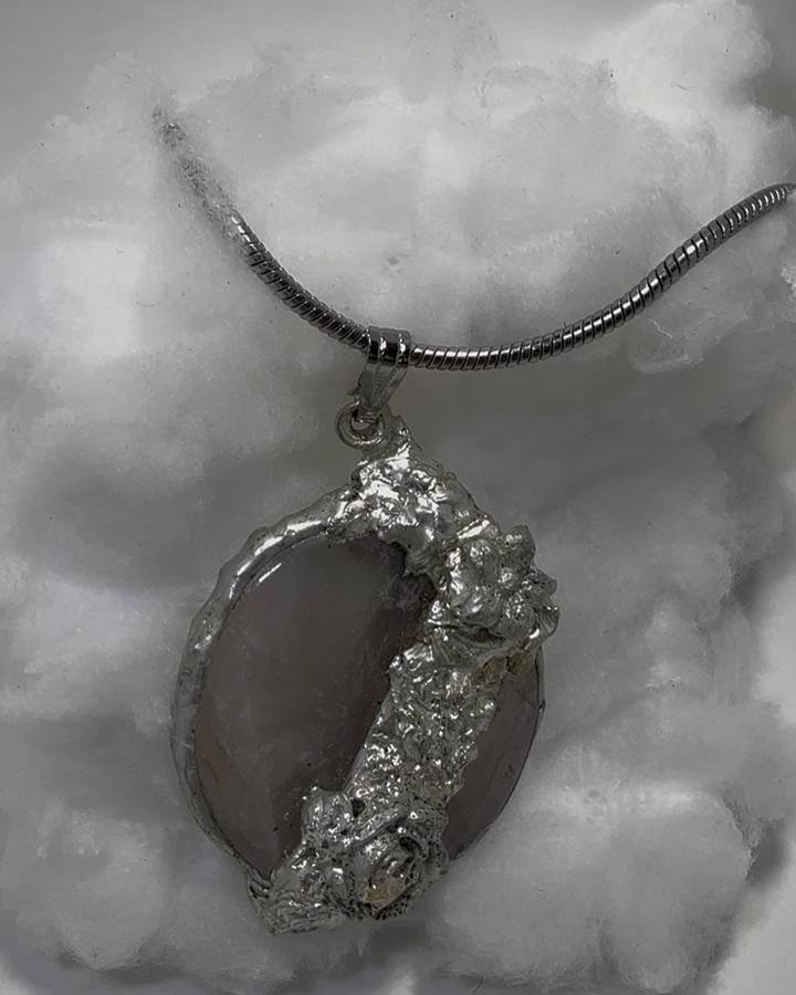 Rose quartz pendant in a free-form soldered silver setting by a Cleveland jewelry artist