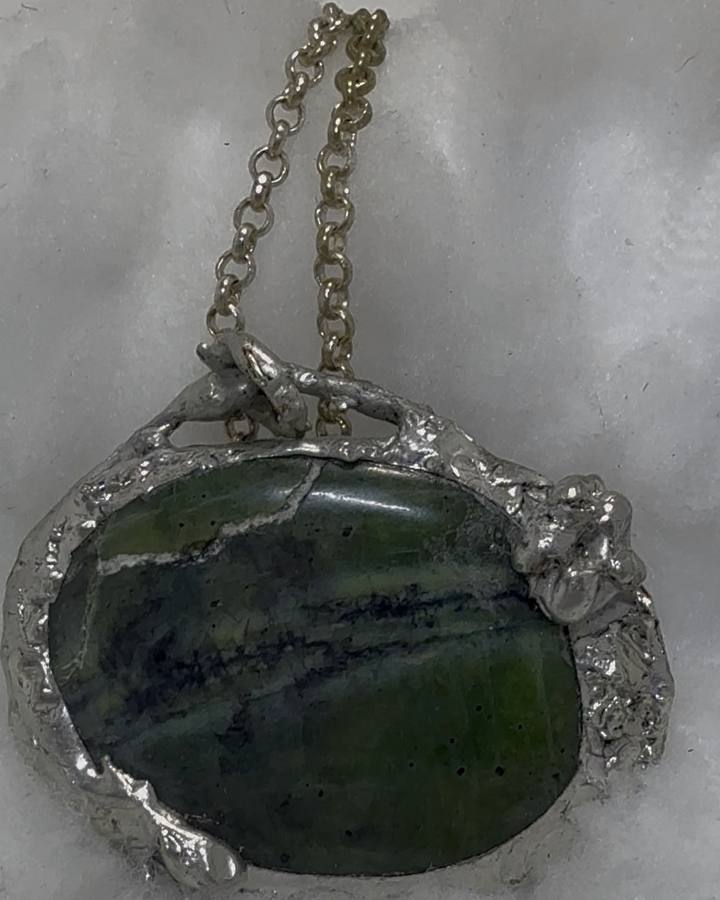 Serpentine stone pendant in a hand soldered silver bezel made in Cleveland Heights Ohio