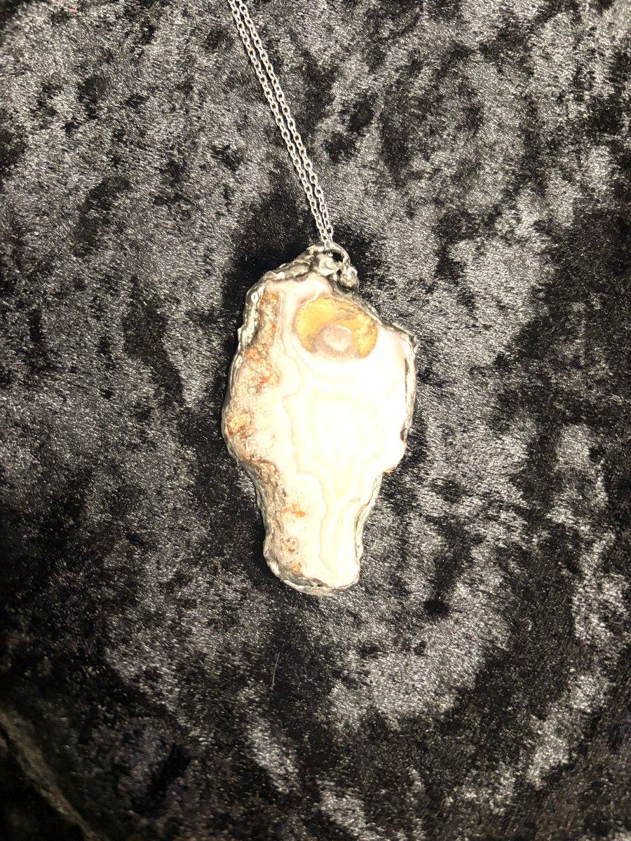 Handmade lace agate stone pendant made by a student at a Cleveland jewelry making class